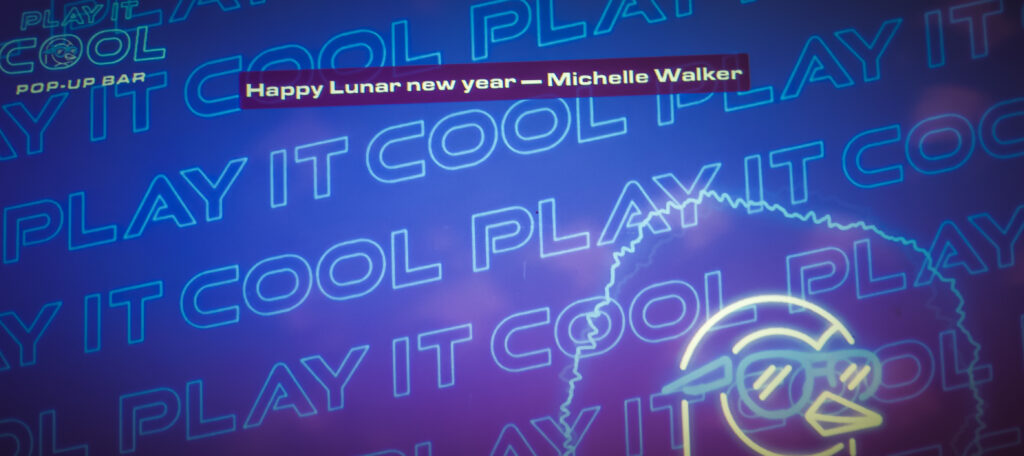 Play It Cool Pop-Up Bar" neon sign with a stylized bird in sunglasses and the message "Happy Lunar New Year — Michelle Walker.